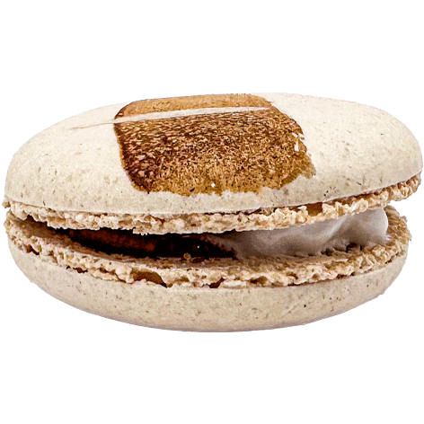 A light coloured macaron with a swipe of chocolate paint across the top, and a mixed chocolate and marshmallow filling