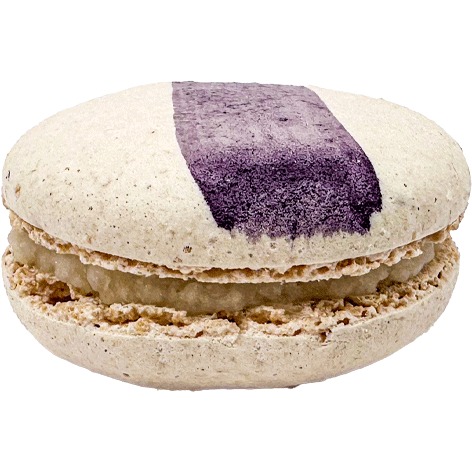 A white macaron with a painted swipe of purple Lavender paint and a light filling