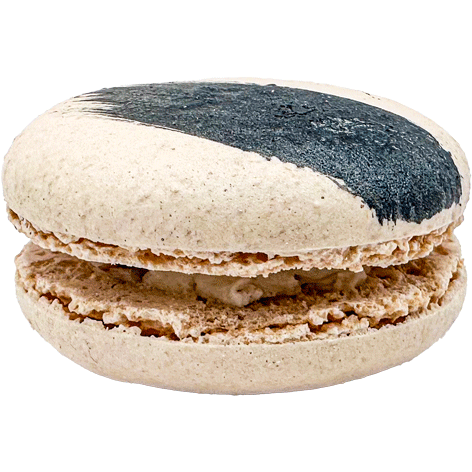 A light coloured macaron with a painted swipe of dark blue and a light coloured filling